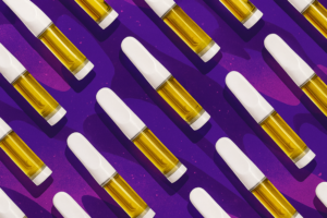 Repeating THC vape cartridges with white mouthpieces arranged diagonally on a purple background.